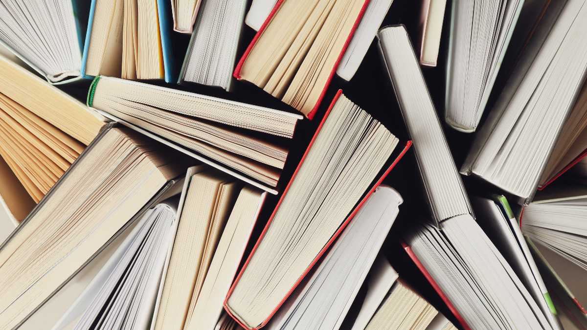 Top view of books closely packed together, standing upright