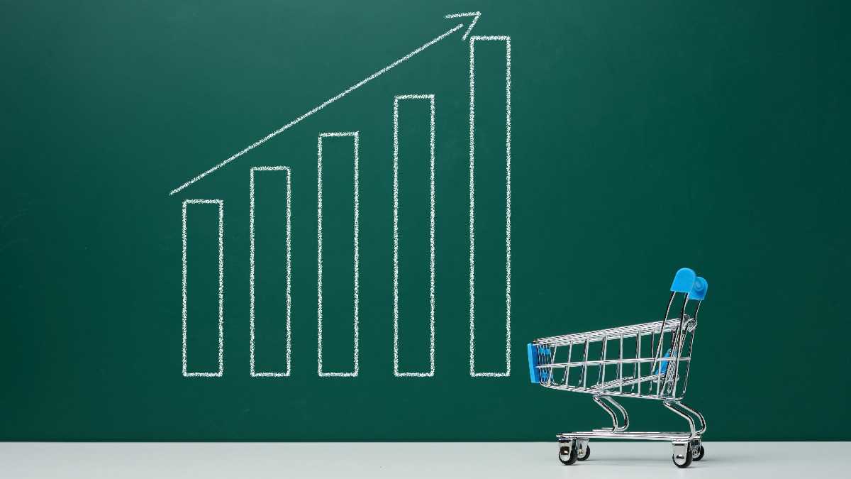 Image of bar graph increasing to the right and mini shopping cart, indicating the rising cost of inflation on everyday goods