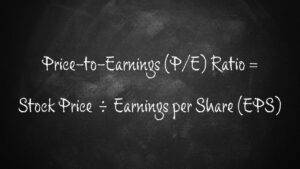 Price-to-Earnings (P/E) Ratio and formulas written on a chalkboard