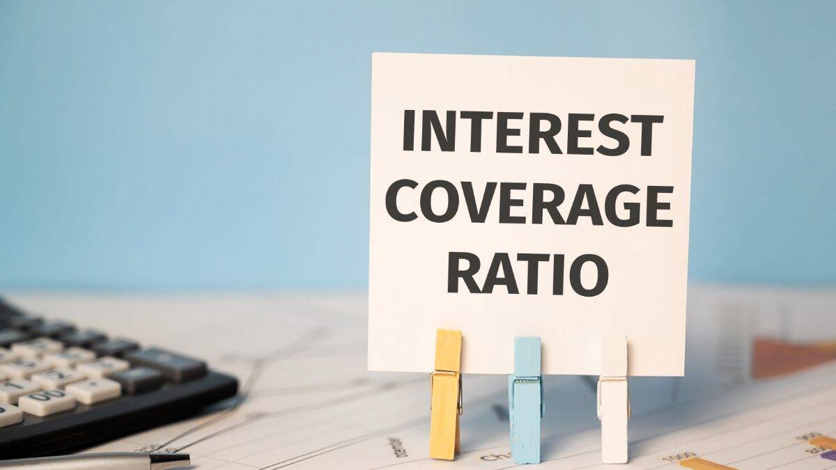 INTEREST COVERAGE RATIO text near financial reports and calculator. Financial concept.